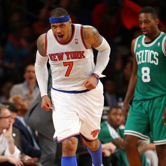 NEW YORK, NY - APRIL 20: Carmelo Anthony #7 of the New York Knicks celebrates a three point basket in the second half as Jeff Green #8 of the Boston Celtics looks on during Game One of the Eastern Conference Quarterfinals of the 2013 NBA Playoffs on April 20, 2013 at Madison Square Garden in New York City. The New York Knicks defeated the Boston Celtics 85-78. NOTE TO USER: User expressly acknowledges and agrees that, by downloading and/or using this photograph, user is consenting to the terms and conditions of the Getty Images License Agreement. (Photo by Elsa/Getty Images)