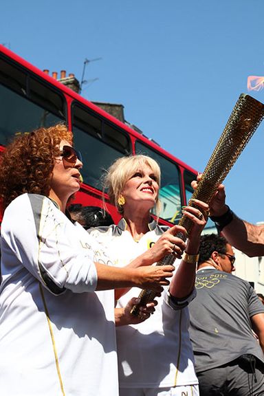 The Best Part of This Picture Is … the confused looks, as if they do not recognize a flame without some sort of burning liquor attached to it.
Is This Person Worthy to Carry the Torch? Does a double-vodka martini count as lunch? (Yes.)