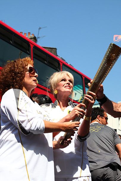 The Best Part of This Picture Is … the confused looks, as if they do not recognize a flame without some sort of burning liquor attached to it.
Is This Person Worthy to Carry the Torch? Does a double-vodka martini count as lunch? (Yes.)