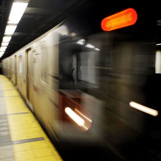 Commuters wait on a platform as a train arrives at a subway station in New York, November 21, 2008. The New York Metropolitan Transportation Authorithy (MTA) said that to plug a 1.2 billion USD budget gap next year, it must increase fare and toll revenues by 23 percent, which would raise an additional 670 USD million if the increase goes into effect in early June. 