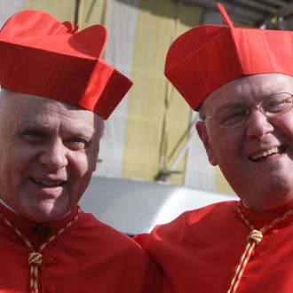 VATICAN CITY, VATICAN - FEBRUARY 18: Newly appointed cardinals Timothy Michael Dolan (R), Archbishop of New York, and Cardinal Frederick O'Brien (L), Archbishop of Baltimora smile as they leave Saint Peter's Basilica after a ceremony held by Pope Benedict XVI on February 18, 2012 in Vatican City, Vatican.The 84 year old Pontiff installed 22 new cardinals during a ceremony today. These men will be responsible for choosing his sucessor. (Photo by Franco Origlia/Getty Images)