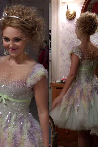The Carrie Diaries is set in the eighties, but a lot of its costumes are more like modern interpretations of eighties fashion rather than Americans-style actual eighties clothes. Carrie's sparkly, ethereal dress for her school's winter formal is no exception: It's Georges Chakra Couture from 2012, but it still has a sort of funky Russian ice-skater vibe to it, too.