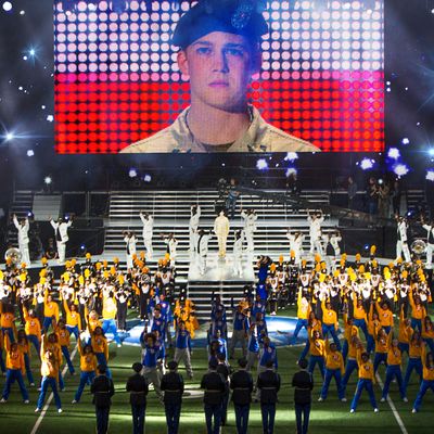 This image released by Sony Pictures shows Joe Alwyn, portraying Billy Lynn, on a screen in a scene from the film, 