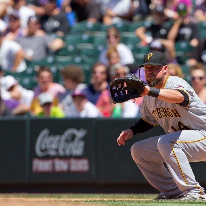 First baseman Casey McGehee #14 of the Pittsburgh Pirates in action against the Colorado Rockies at Coors Field on July 18, 2012 in Denver, Colorado. The Pirates defeated the Rockies 9-6 to win the three game series. 
