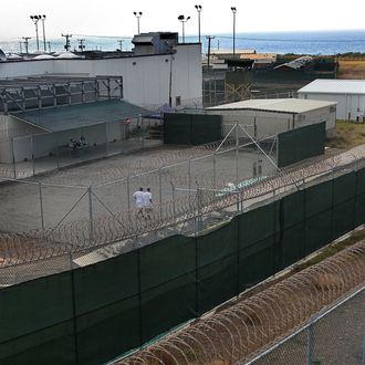 Detainees jog in a recreation yard at Camp 6 in the Guantanamo Bay detention center on March 30, 2010 in Guantanamo Bay, Cuba. 