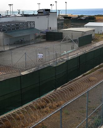 Detainees jog in a recreation yard at Camp 6 in the Guantanamo Bay detention center on March 30, 2010 in Guantanamo Bay, Cuba. 