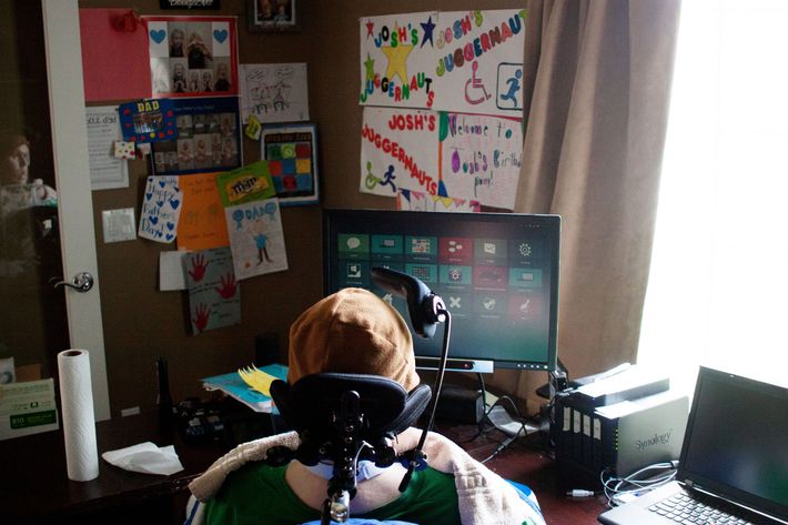 Josh Gentry sits in front of his computer, which he can control through eye movements.
