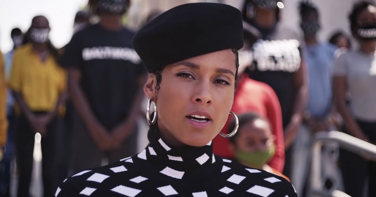 Watch Alicia Keys raise her voice and sing Super Bowl Spot