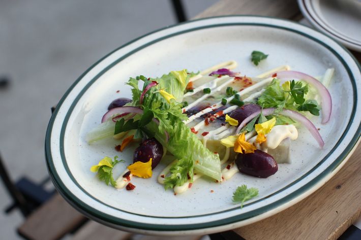 Rock crab causa with avocado, purple potato, and olive.