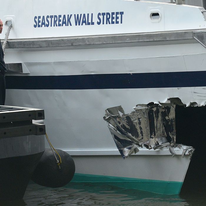 New York Mayor Michael Bloomberg inspects the damage after the commuter ferry slammed into a pier in New York, January 9, 2013. About 50 people were injured when a rush-hour ferry packed with commuters smashed into a pier in New York City on Wednesday, firefighters said. The accident took place at 8:45 am (1345 GMT) on Pier 11 in the East River in lower Manhattan, not far from Wall Street, the New York Fire Department said. The ferry was arriving from New Jersey. 