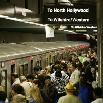 LOS ANGELES, CA - JUNE 3: Passengers board Metrolink subway trains during rush hour June 3, 2008 in Los Angeles, California. Skyrocketing gas prices are driving more commuters to take trains and buses to work instead of their cars. In the first three months of 2008, the number of trips taken on public transport in the US rose 3 percent to 2.6 billion, creating pressures on some transportation systems to cope with increasing ridership. Transit officials in southern California and elsewhere are now encouraging employers to stagger employee schedules to ease the rush hour crunch on trains and buses and Metrolink plans to add 107 rail cars to its fleet of 155 as soon as next year. (Photo by David McNew/Getty Images)