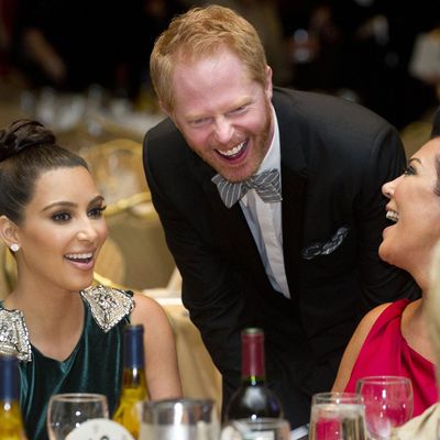 Kris Jenner (R), Kim Kardashian (L) and actor Jesse Tyler Ferguson (C) attend the White House Correspondents Association Dinner in Washington, DC, April 28, 2012. The annual event, which brings together US President Barack Obama, Hollywood celebrities, news media personalities and Washington correspondents, features comedian Jimmy Kimmel as the host. AFP PHOTO / Saul LOEB (Photo credit should read SAUL LOEB/AFP/GettyImages)