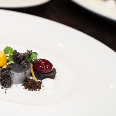 Black sesame panna cotta, sour cherry sphere, mandarin sorbet (Chef Laiskonis).