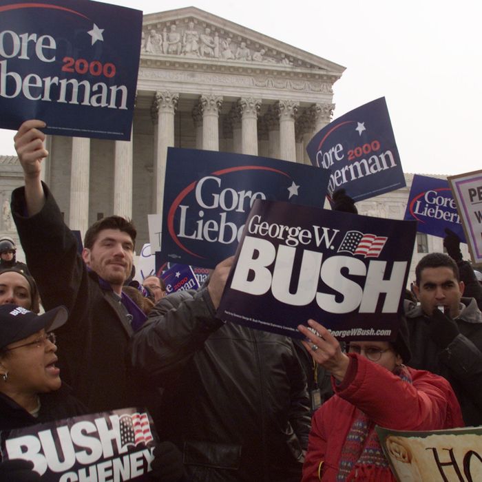 Bush and Gore supporters argue their point to each other in front of the U.S. Supreme Court building December 11, 2000 in Washington, DC.