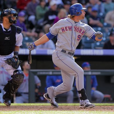 Kirk Nieuwenhuis #9 of the New York Mets hits an RBI double off of Matt Belisle #34 of the Colorado Rockies to score Mike Baxter #23 of the New York Mets in the 10th inning at Coors Field on April 29, 2012 in Denver, Colorado. 