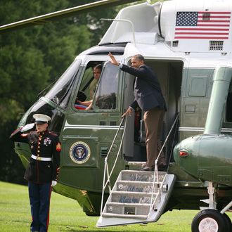 WASHINGTON, D.C. - MAY 5: President Barack Obama and first lady Michelle Obama leave the White House for the first official campaign rallies of the 2012 election season in Ohio and Virginia on May 5, 2012 in Washington, D.C. (Photo by Martin H. Simon-Pool/Getty Images)