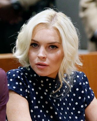LOS ANGELES, CA - NOVEMBER 02: Lindsay Lohan sits in court during her probation violation hearing at the Airport Courthouse on November 2, 2011 in Los Angeles, California. Lohan was sentenced to 300 days in jail, starting November 9, for violating her probation but will only server 30 days if she follows the conditions set out by Judge Sautner which include serving the remainder of her community service at the Los Angeles County Coroner's office and attending psychotherapy sessions. Lohan had previously been sentenced to a total of 480 hours of community service stemming from a 2007 drunk-driving conviction and a jewelry theft conviction earlier this year. (Photo by Mario Anzuoni-Pool/Getty Images)