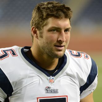 Tim Tebow #5 of the New England Patriots looks on after the game against the Detroit Lions at Ford Field on August 22, 2013 in Detroit, Michigan. The Lions defeated the Patriots 40-9. 