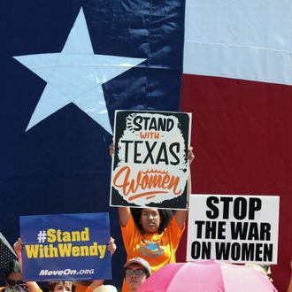 AUSTIN, TX - JULY 01: Supporters of Texas women's right to reproductive decisions rally at the Texas State capitol on July 1, 2013 in Austin, Texas. This is first day of a second legislative special session called by Texas Gov. Rick Perry to pass an restrictive abortion law through the Texas legislature. The first attempt was defeated after opponents of the law were able to stall the vote until after first special session had ended.