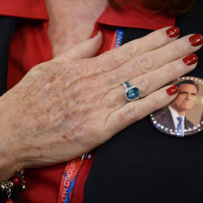 A woman holds her hand to her heart during the US National Anthem at the start of the third session of the Republican National Convention at the Tampa Bay Times Forum in Tampa, Florida, USA, 29 August 2012. Vice Presidential running mate Paul Ryan will be the featured speaker for the session. 