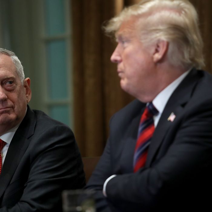 U.S. Defense Secretary Jim Mattis listens as U.S. President Donald Trump answers questions during a meeting with military leaders in the Cabinet Room on October 23, 2018 in Washington, DC.
