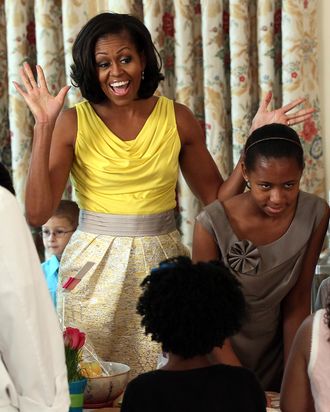 WASHINGTON, DC - MAY 10: U.S. first lady Michelle Obama participates in honoring the upcoming Military Spouse Appreciation Day and in support of military families celebrating Mother's Day during an event in the State Dining Room at the White House May 10, 2012 in Washington, DC. Obama and Dr. Jill Biden began by hosting a Joining Forces Mother's Day event for three generations of military families and military mothers, as well as participating in a Joining Forces service to provide care packages to military mothers who have loved ones serving abroad. (Photo by Win McNamee/Getty Images)