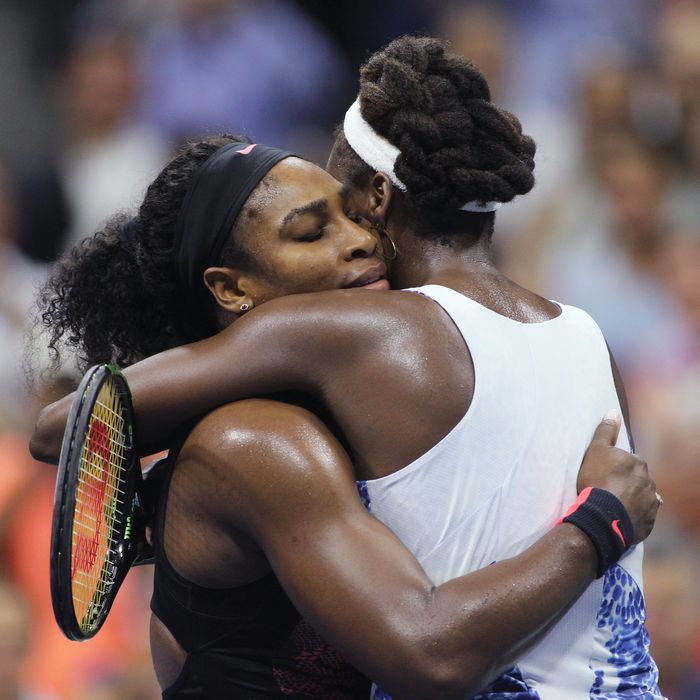 Serena Williams, USA and sister Venus Williams, USA, embrace after in their Women's Singles Quarterf