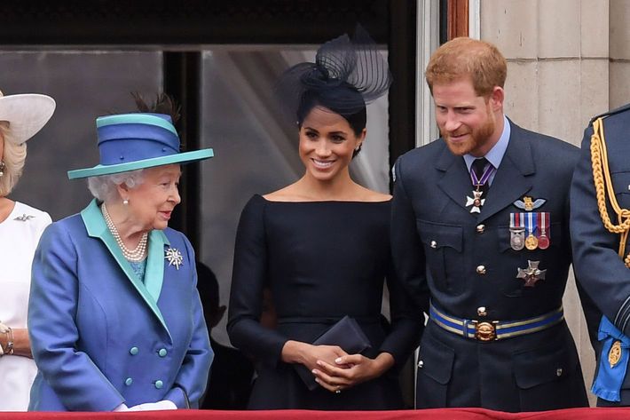 Queen Elizabeth, Meghan Markle, and Prince Harry.