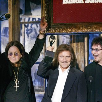 New York, UNITED STATES: Inductees Ozzy Osbourne, Geezer Butler and Tony Iommi of Black Sabbath after being inducted during the Rock and Roll Hall of Fame Induction Ceremony in New York 13 March 2006. The Rock and Roll Hall of Fame Museum's permanent collection is in Cleveland Ohio. AFP PHOTO Timothy A. CLARY (Photo credit should read TIMOTHY A. CLARY/AFP/Getty Images)