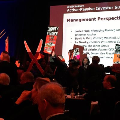 More than two dozen protester holding signs and shouting hedge fund managers' names to protest low wages at fast food restaurants interrupted a hedge fund industry conference in New York April 13, 2015. Shouting 