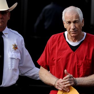 BELLEFONTE, PA - OCTOBER 09: Former Penn State assistant football coach Jerry Sandusky leaves the Centre County Courthouse after being sentenced in his child sex abuse case on October 9, 2012 in Bellefonte, Pennsylvania. The 68-year-old Sandusky was sentenced to at least 30 years and not more that 60 years in prison for his conviction in June on 45 counts of child sexual abuse, including while he was the defensive coordinator for the Penn State college football team. (Photo by Patrick Smith/Getty Images)