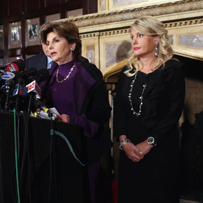 NEW YORK, NY - NOVEMBER 07: Sharon Bialek (R) listens as her attorney Gloria Allred (L) speaks during a news conference to accuse Republican presidential candidate Herman Cain of sexual harassment more than a decade ago on November 7, 2011 in New York City. Bialek is the fourth woman to accuse Cain of inappropriate behavior when he was while CEO of the National Restaurant Association. She stated she is speaking out because she wanted to give 