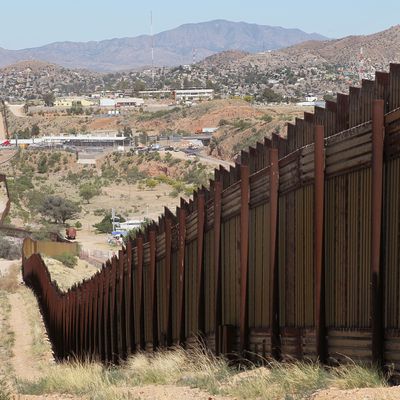 NOGALES, AZ - JUNE 02: A fence separates the cities of Nogales, Arizona (L) and Nogales, Sonora Mexico, a frequent crossing point for people entering the United States illegally, June 2, 2010 in Nogales, Arizona. During the 2009 fiscal year 540,865 undocumented immigrants were apprehended entering the United States illegally along the Mexican border, 241,000 of those were captured in the 262 mile stretch of the border known as the Tucson Sector. (Photo by Scott Olson/Getty Images)