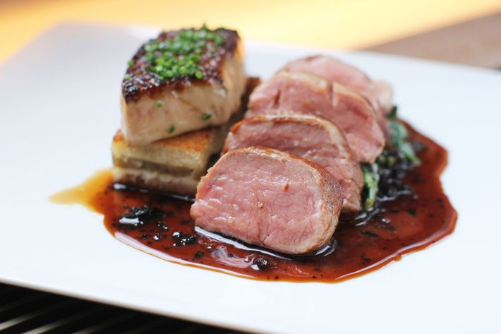 Veal tenderloin with seared foie gras, caramelized-onion tartine, and a black truffle jus.