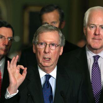 Senate Minority Leader Mitch McConnell (R-KY) (C) speaks to the media while flanked by Sen. John Barrasso (R-WY) (L), Sen. John Cornyn (R-TX) (R) and Sen. John Thune (R-SD) on April 9, 2013 in Washington, DC. The Senators spoke briefly to reporters after attending their Republican policy luncheon.