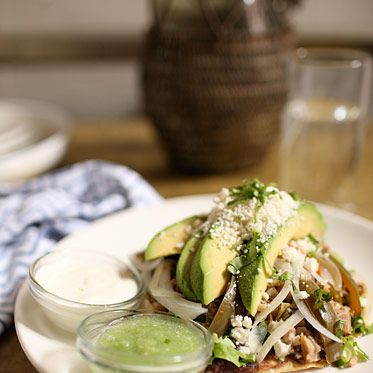 House-made tostada, pickled pigs feet, lettuce, crema