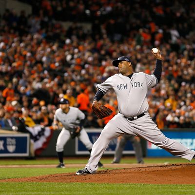 CC Sabathia #52 of the New York Yankees throws a pitch against the Baltimore Orioles during Game One of the American League Division Series at Oriole Park at Camden Yards on October 7, 2012 in Baltimore, Maryland.