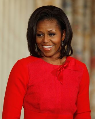 WASHINGTON, DC - NOVEMBER 21: First lady Michelle Obama introduces delivers opening ramarks during a student music program in the State Dining Room of the White House November 21, 2011 in Washington, DC. Part of a program called 