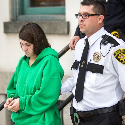 Miranda Barbour, 19, is led out of the courthouse after her preliminary hearing, Friday, Dec. 20, 2013 in Sunbury, Pa. Miranda and Elytte Barbour, newlyweds who police said wanted to kill someone together were ordered Friday to stand trial on charges they lured a stranger with a Craigslist ad, stabbed him to death after he got into their car and dumped his body in an alley. 
