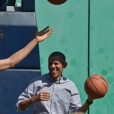 US President Barack Obama plays basketball during the annual Easter Egg Roll on the South Lawn of the White House on April 6, 2015 in Washington, DC.