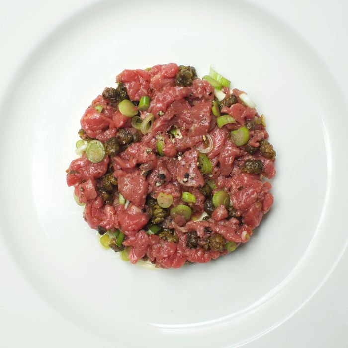 Steak tartare with fried capers, spring onions, and spiced mayonnaise.