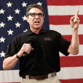 Texas Gov. Rick Perry campaigns for U.S. Senate Republican candidate and North Carolina House Speaker Thom Tillis at the Conservative Rally, North Carolina's largest annual political rally, October 24, 2014 in Smithfield, North Carolina. Tillis is locked in a tight race with Sen. Kay Hagan (D-NC) with less than two weeks until the midterm elections.