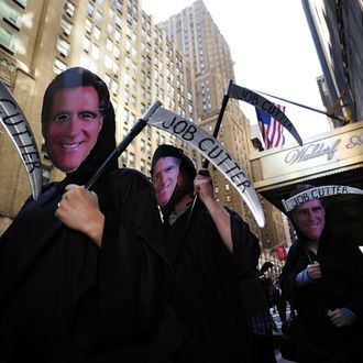 Occupy Wall Street protesters, dressed as billionaires, stage a demonstration against US Republican presidential candidate Mitt Romney in front of the Waldorf Astoria hotel as Romney holds a campaign fundraiser inside the hotel, in New York, March 14, 2012. AFP PHOTO/Emmanuel Dunand (Photo credit should read EMMANUEL DUNAND/AFP/Getty Images)