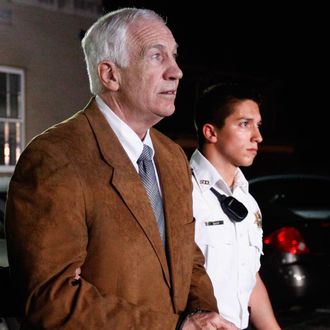 BELLEFONTE, PA - JUNE 22: Former Penn State assistant football coach Jerry Sandusky leaves the Centre County Courthouse in handcuffs after a jury found him guilty in his sex abuse trial on June 22, 2012 in Bellefonte, Pennsylvania. The jury found Sandusky guilty on 45 of 48 counts in the sexual abuse trial of the former Penn State assistant football coach, who was charged with sexual abuse of 10 boys over a 15-year period. (Photo by Rob Carr/Getty Images)