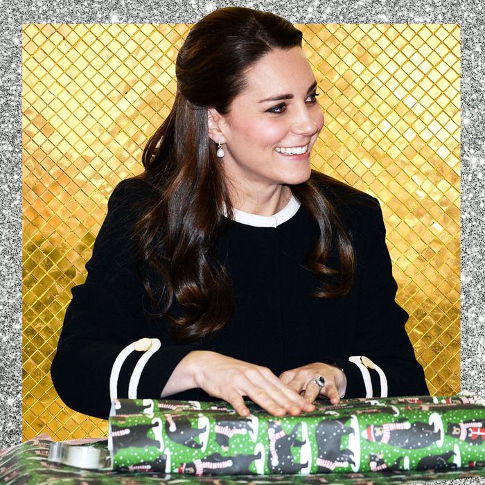 Kate Middleton wrapping a Christmas present.