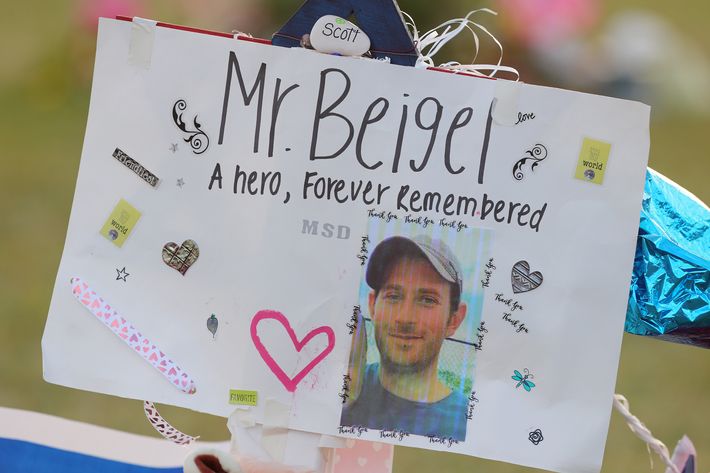 A memorial sign for Scott Beigel at Pine Trails Park in Parkland, Florida.