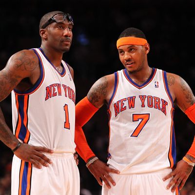 Amare Stoudemire #1 , and Carmelo Anthony #7 of the New York Knicks talk during their pre season game against the New Jersey Nets.