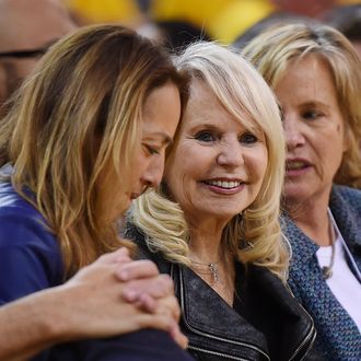 OAKLAND, CA - APRIL 27: Shelly Sterling (C), the wife of Donald Sterling owner of the Los Angeles Clippers, watches the Clippers against the Golden State Warriors in Game Four of the Western Conference Quarterfinals during the 2014 NBA Playoffs at ORACLE Arena on April 27, 2014 in Oakland, California. The players wore theirs warm up this way in protest of owner Donald Sterling's racially insensitive remarks. NOTE TO USER: User expressly acknowledges and agrees that, by downloading and or using this photograph, User is consenting to the terms and conditions of the Getty Images License Agreement. (Photo by Thearon W. Henderson/Getty Images)