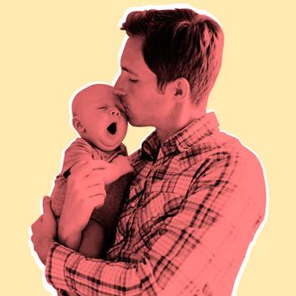 Father kissing baby son (2-5 months)