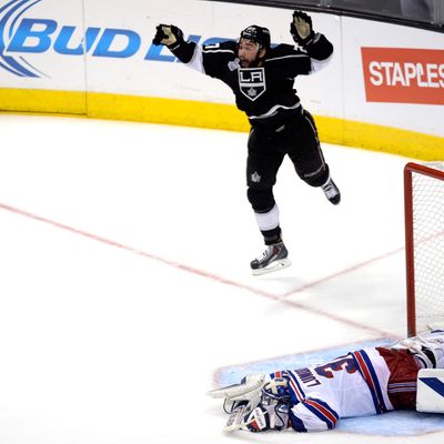 LOS ANGELES, CA - JUNE 13: Alec Martinez #27 of the Los Angeles Kings celebrates after scoring the game-winning goal in double overtime against Henrik Lundqvist #30 of the New York Rangers during Game Five of the 2014 Stanley Cup Final at Staples Center on June 13, 2014 in Los Angeles, California. (Photo by Kevork Djansezian/Getty Images)